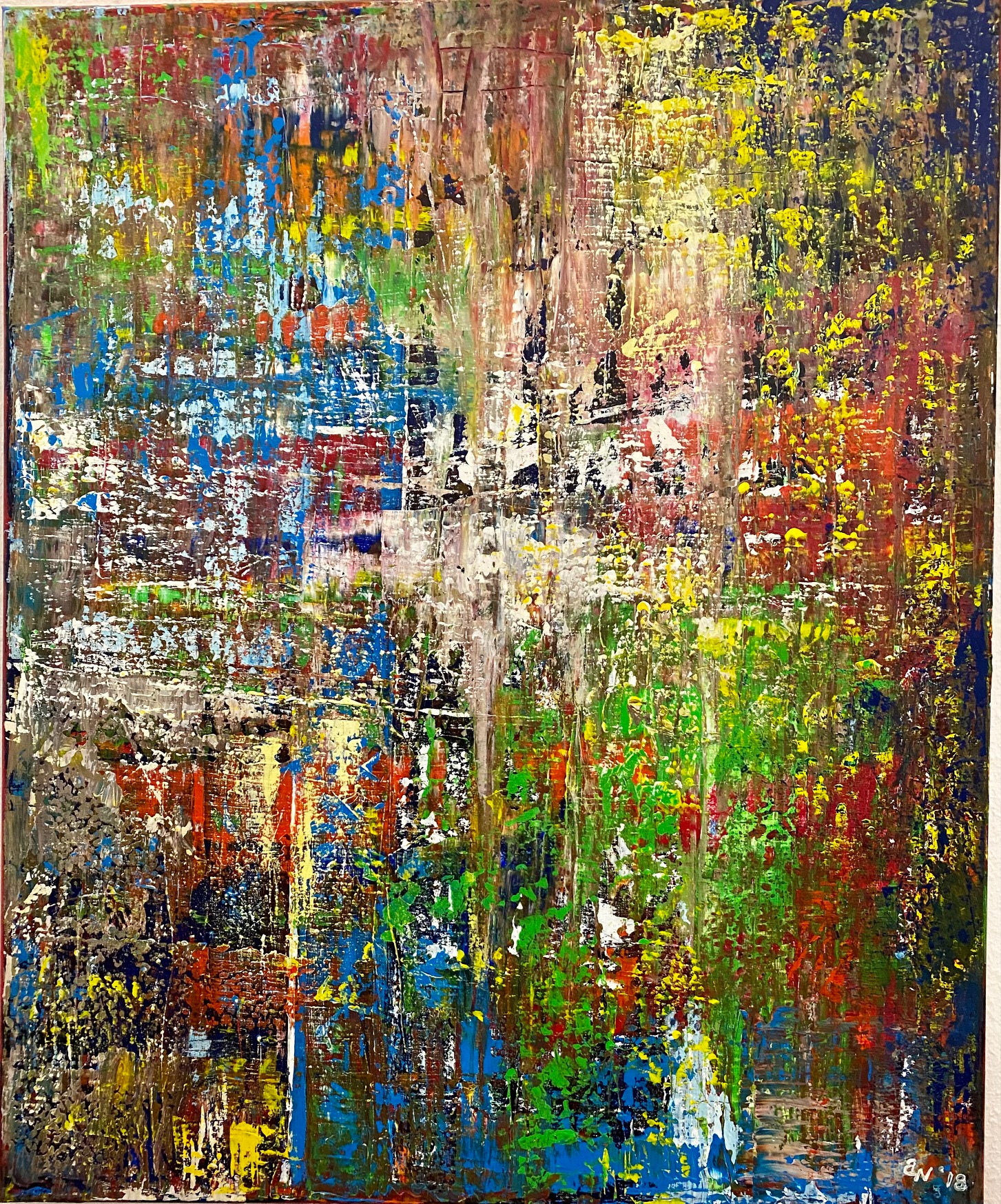 Eine abstrakte Malerei mit vielen verschiedenen Farben, darunter Blau, Grün, Gelb, Rot und Weiß. Die Farben sind in unregelmäßigen Mustern und Texturen aufgetragen.